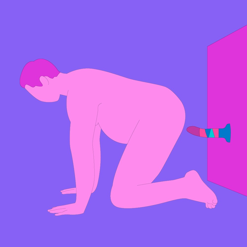 A naked illustrated person on their hands and knees, with a suction-cup dildo on the wall behind them.